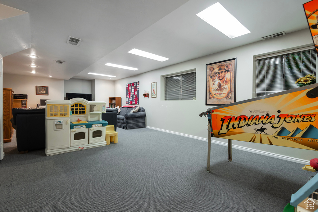Rec room featuring carpet floors and baseboards