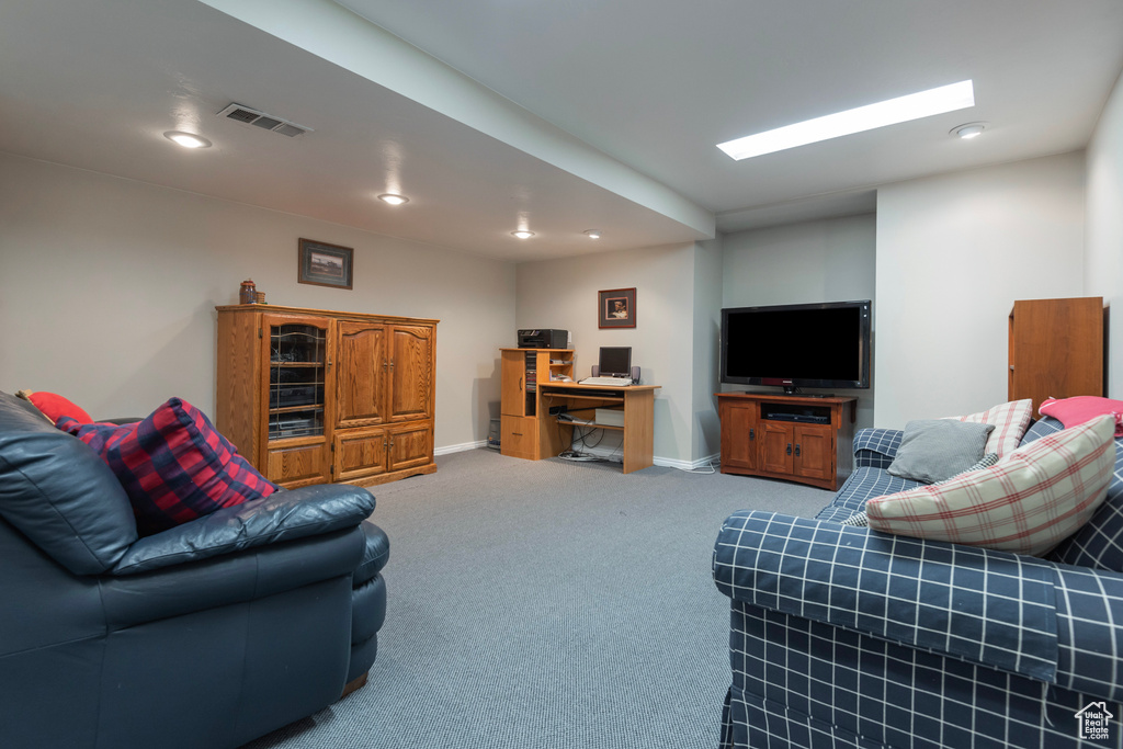 Living room with carpet floors, recessed lighting, a desk, and baseboards