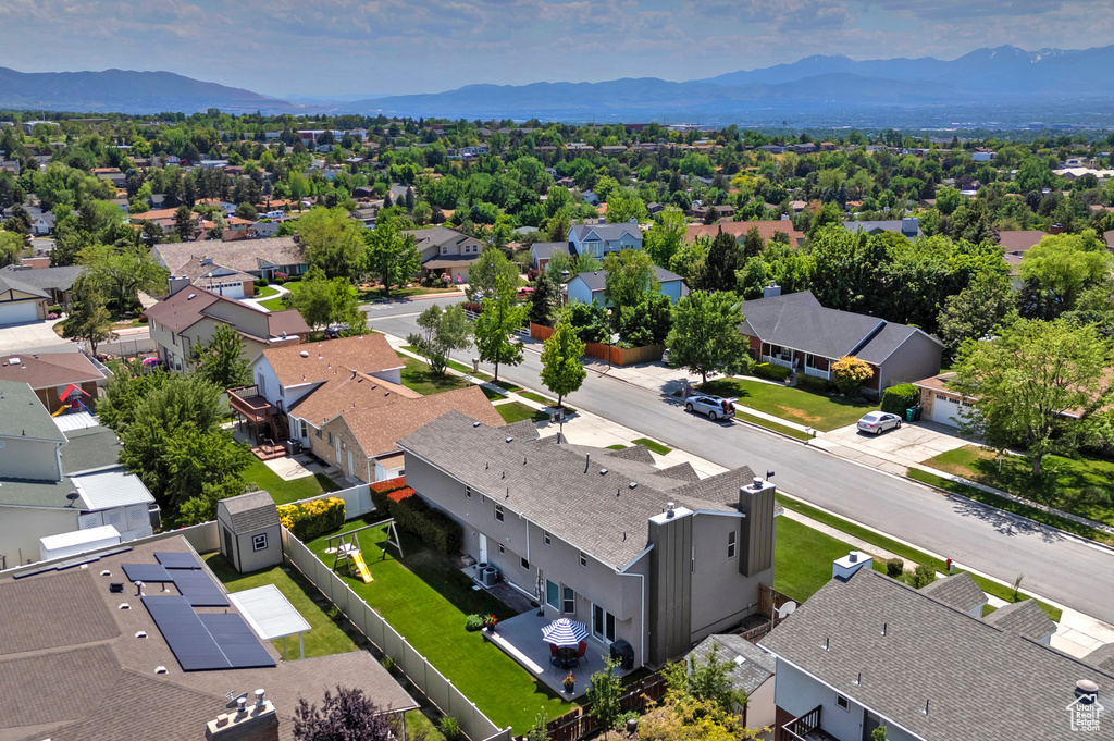 Aerial view of residential area featuring mountains