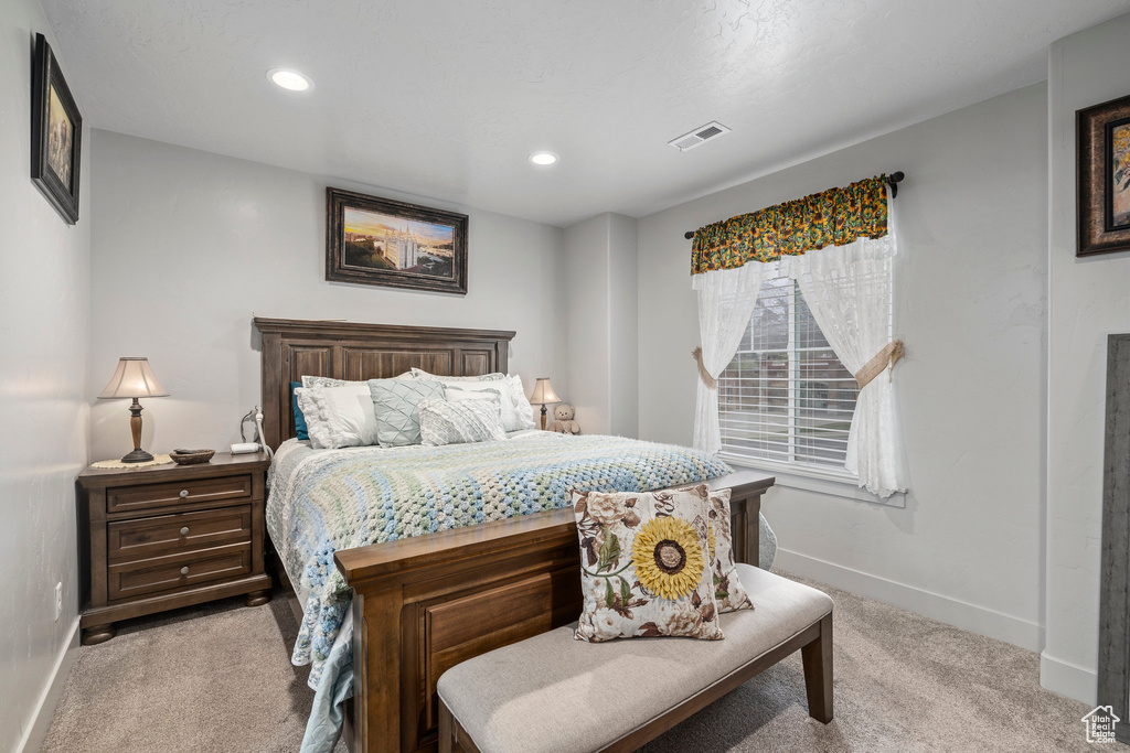 Bedroom with carpet floors, baseboards, and recessed lighting