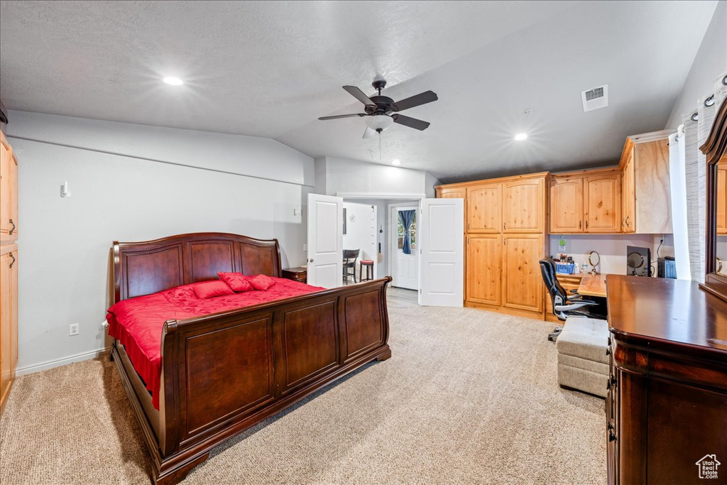 Bedroom with light carpet, lofted ceiling, an office area, a ceiling fan, and recessed lighting