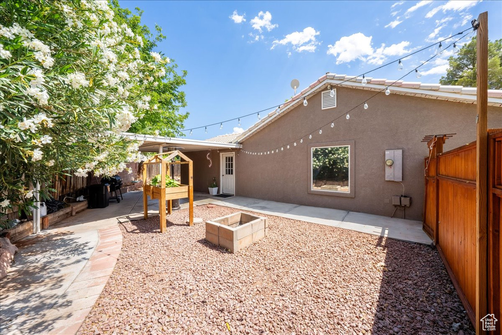 Back of house featuring a patio area and stucco siding
