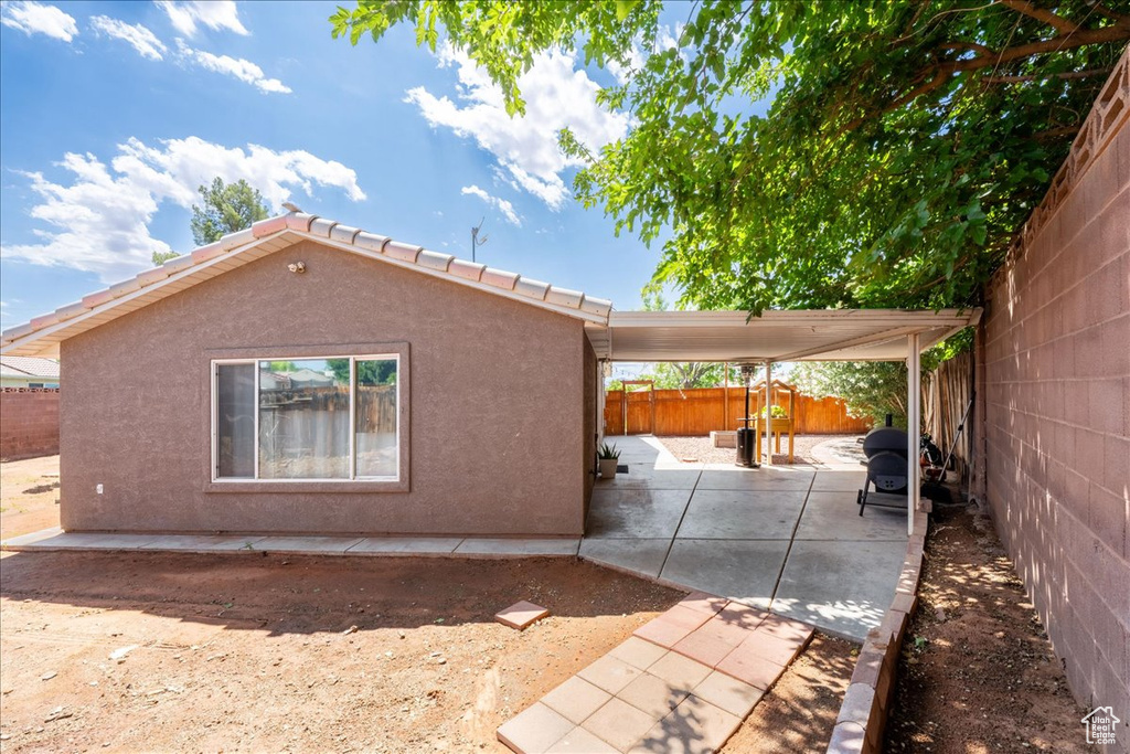 View of home's exterior featuring a patio area, stucco siding, and a fenced backyard