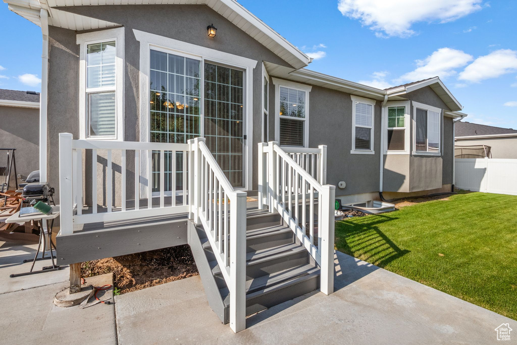 View of exterior entry featuring stucco siding