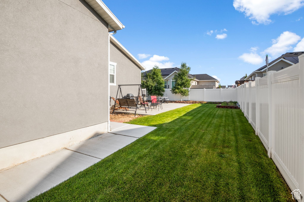 View of yard with a patio area and a residential view