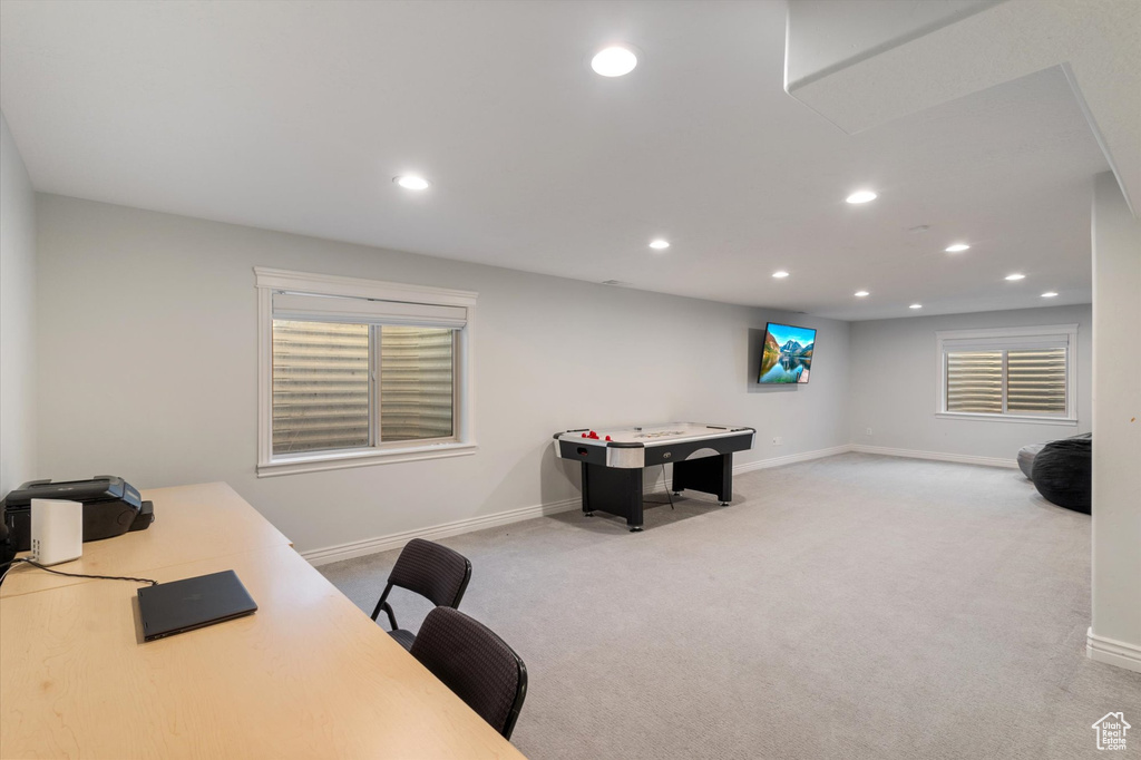 Office space featuring light colored carpet, recessed lighting, and baseboards