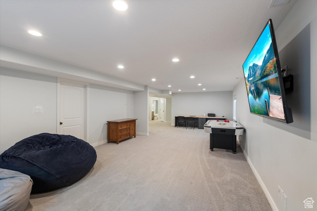 Game room featuring recessed lighting, light carpet, and baseboards