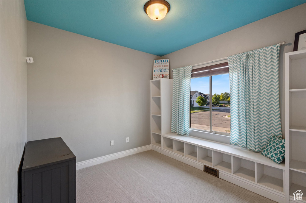 Spare room with baseboards and carpet floors