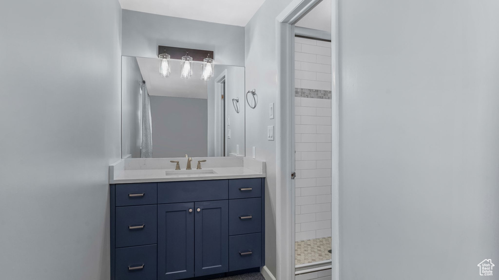 Bathroom featuring vanity and a stall shower