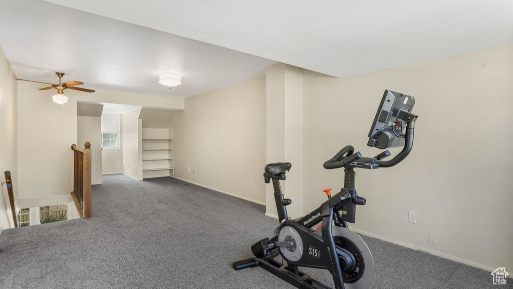Workout area with carpet floors and baseboards