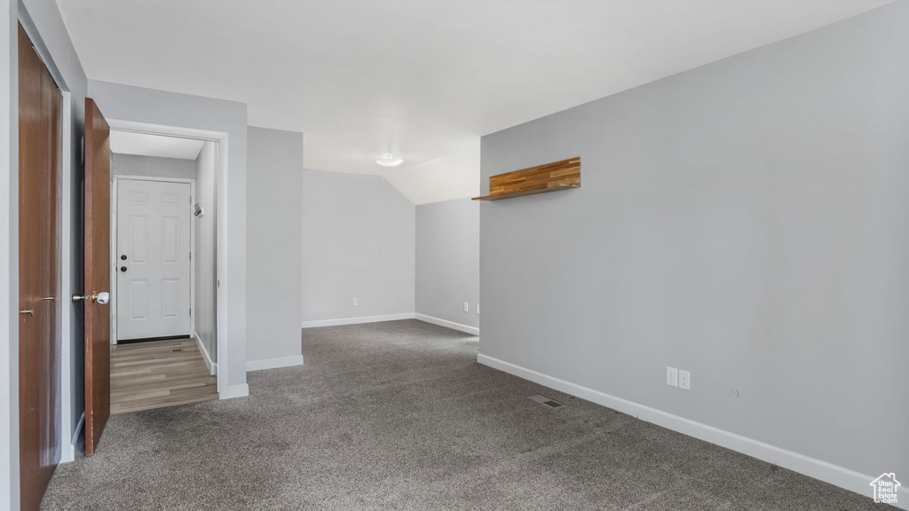 Empty room with carpet flooring and baseboards