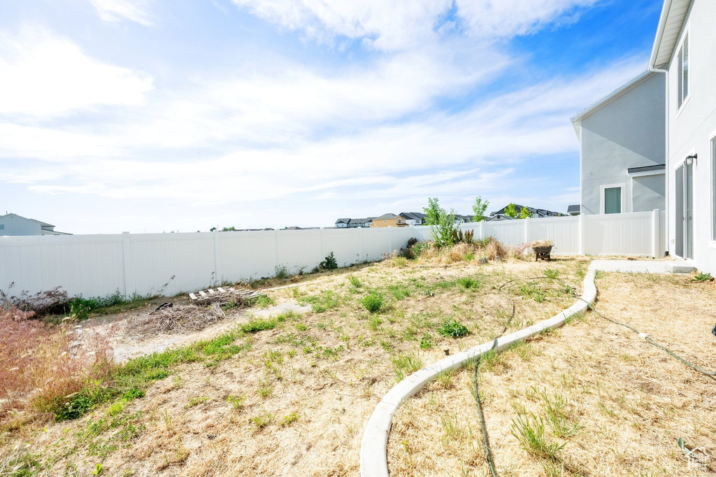 View of fenced backyard