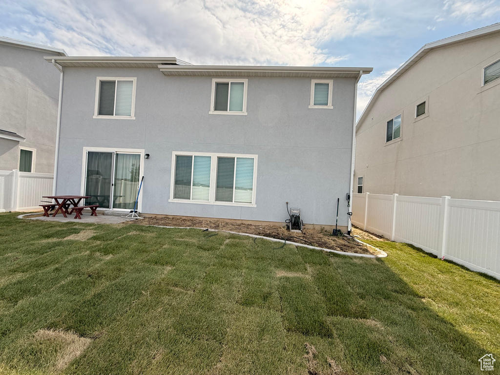 Back of property with stucco siding