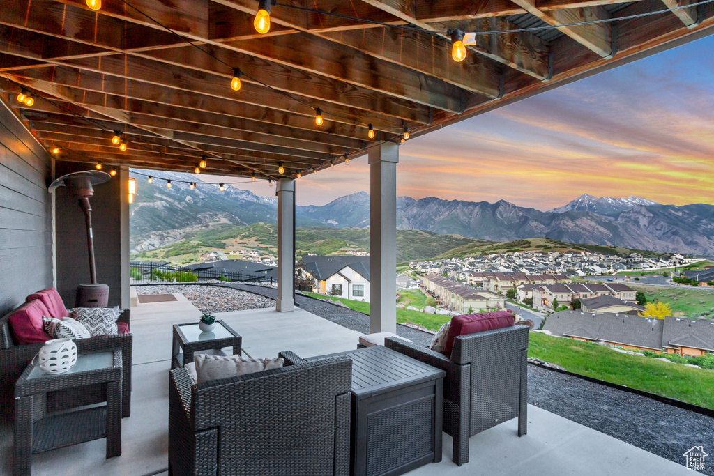 View of patio featuring a mountain view and an outdoor hangout area