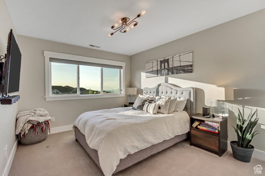 Carpeted bedroom with baseboards