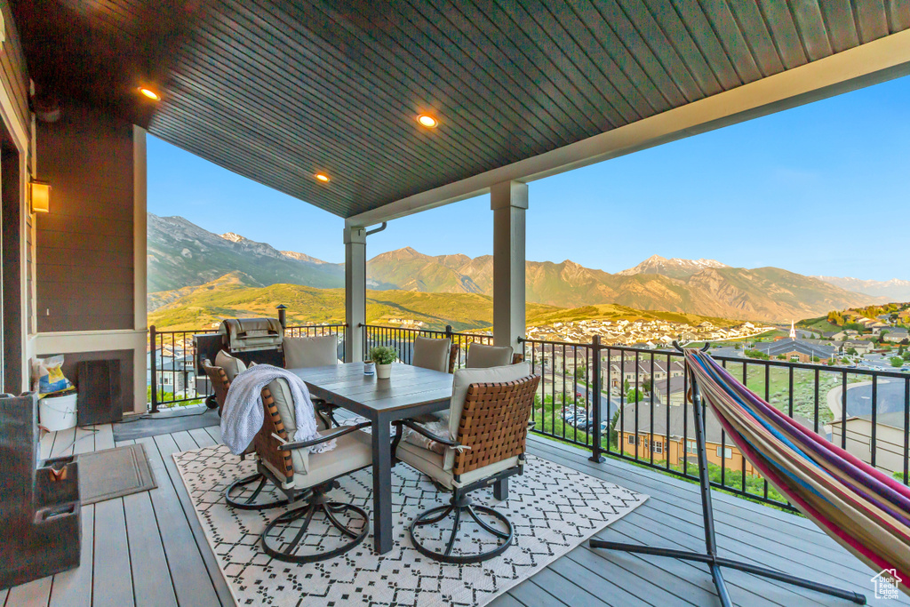Wooden terrace featuring a mountain view