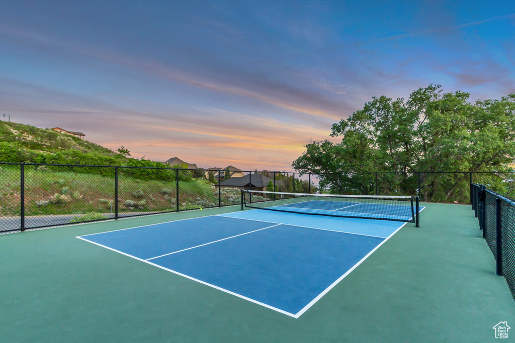 View of tennis court with community basketball court
