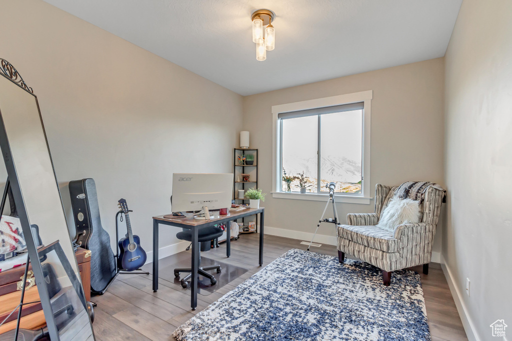 Office space with light wood finished floors and baseboards