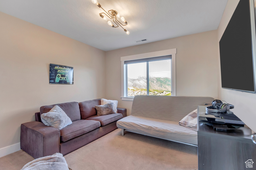 Living area featuring baseboards and carpet flooring