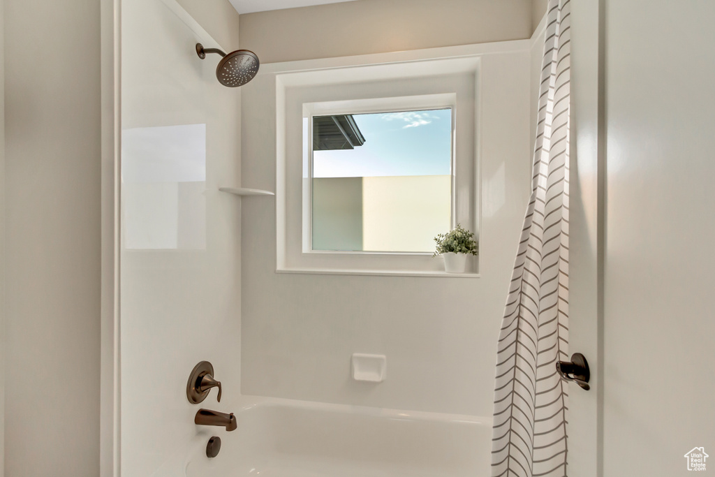 Full bath featuring washtub / shower combination