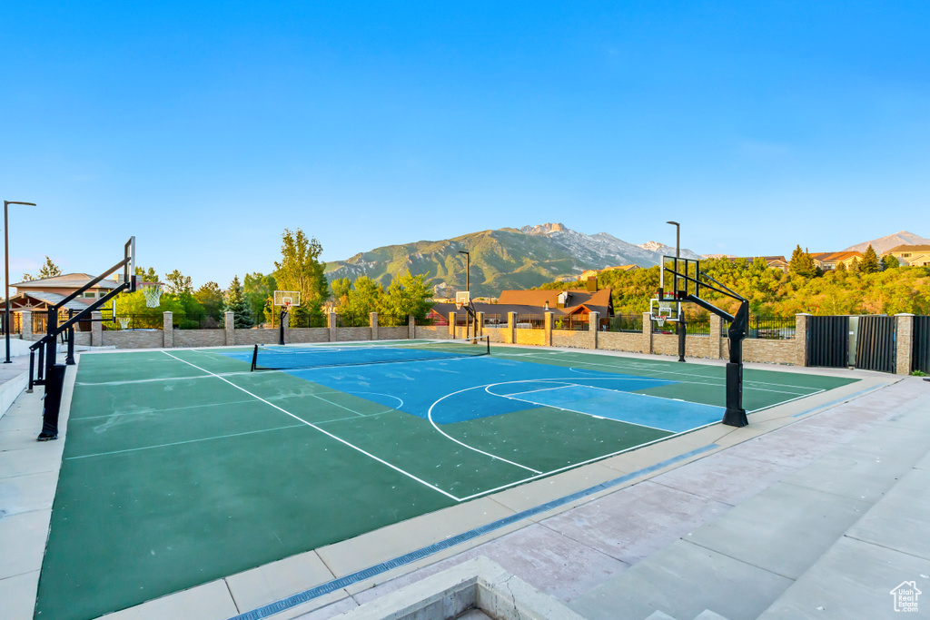 View of sport court with community basketball court and a mountain view