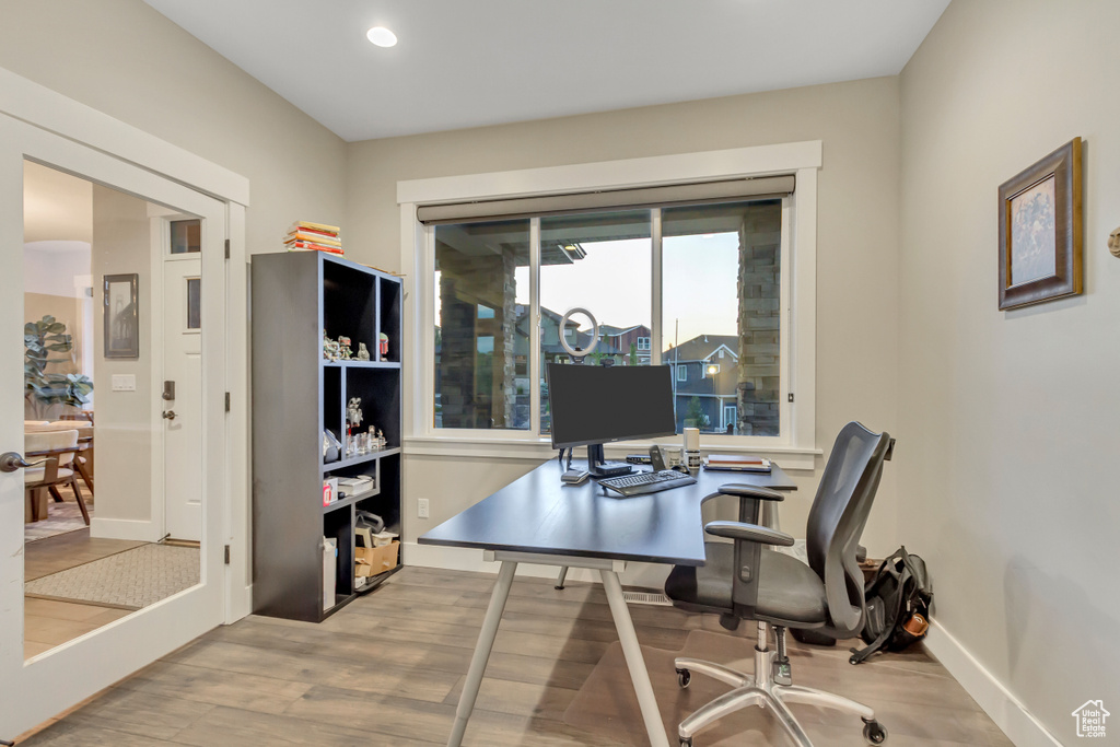 Office featuring wood finished floors, baseboards, and recessed lighting
