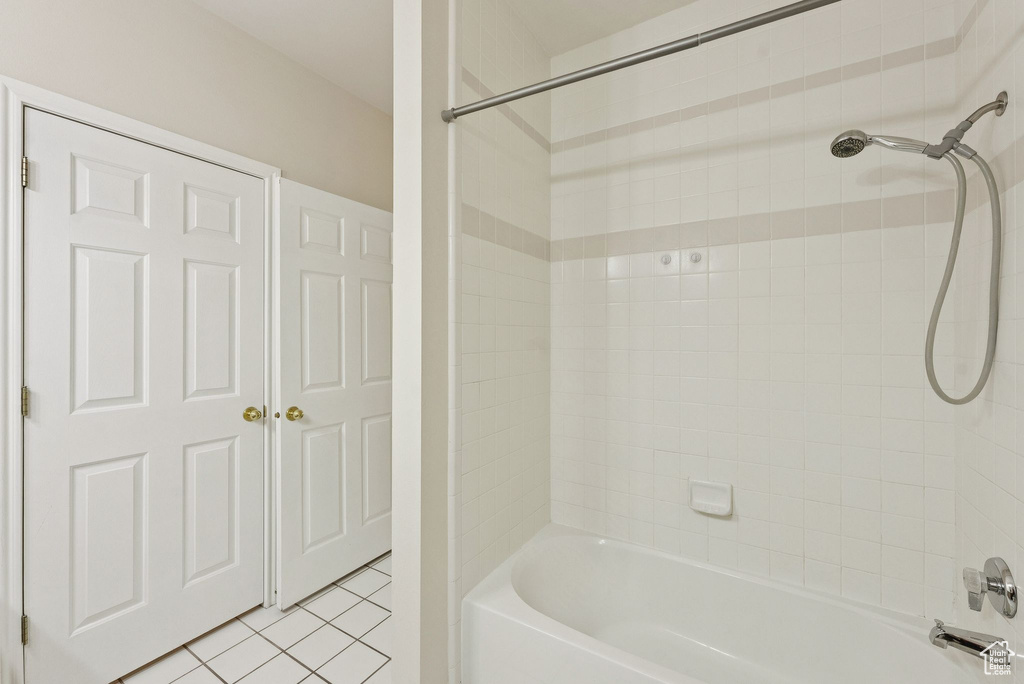 Full bath featuring bathtub / shower combination and tile patterned floors