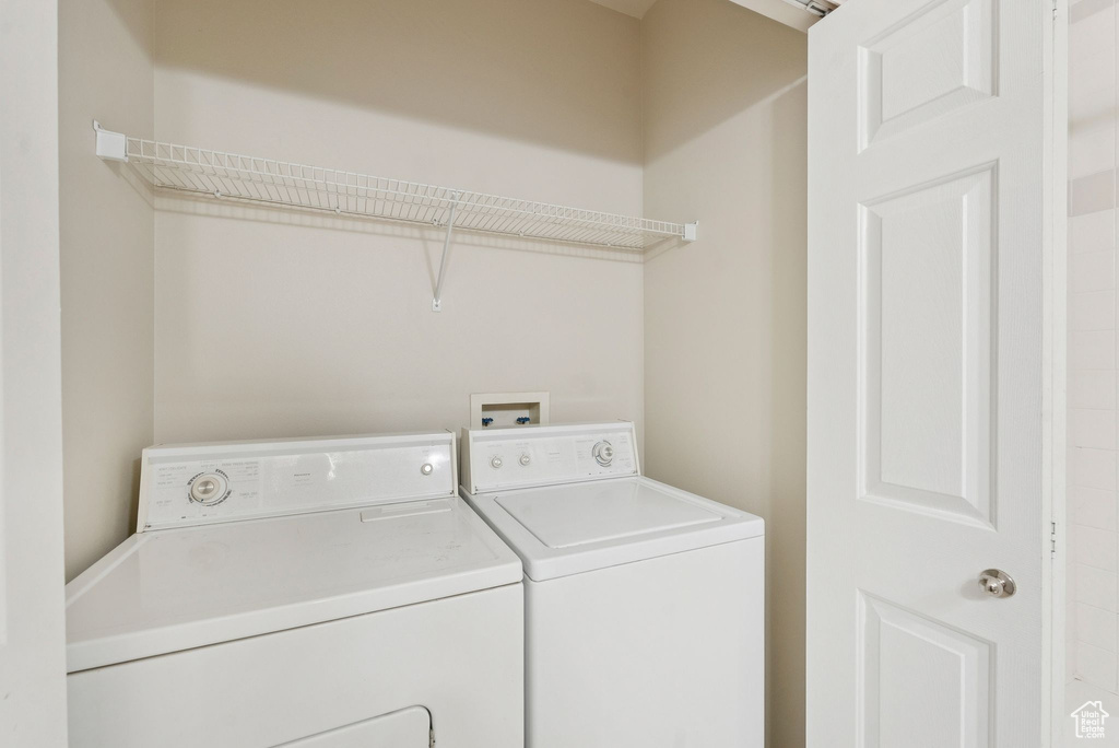 Laundry area with washer and clothes dryer