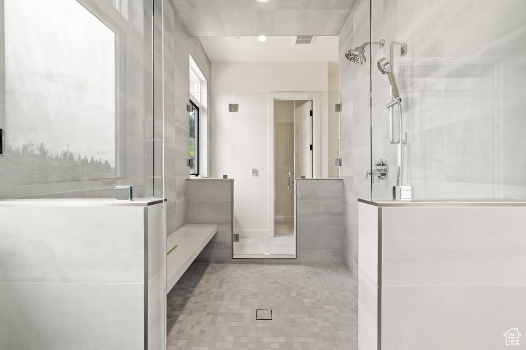Full bathroom featuring a shower stall, tile patterned floors, and recessed lighting