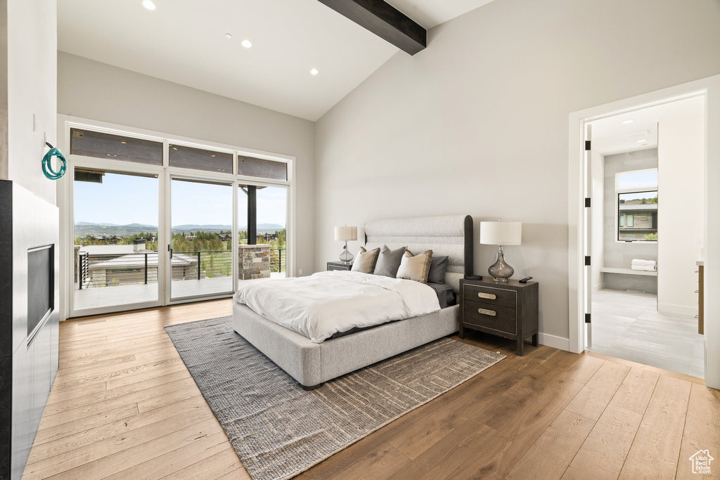 Bedroom with access to outside, beam ceiling, hardwood / wood-style flooring, high vaulted ceiling, and recessed lighting
