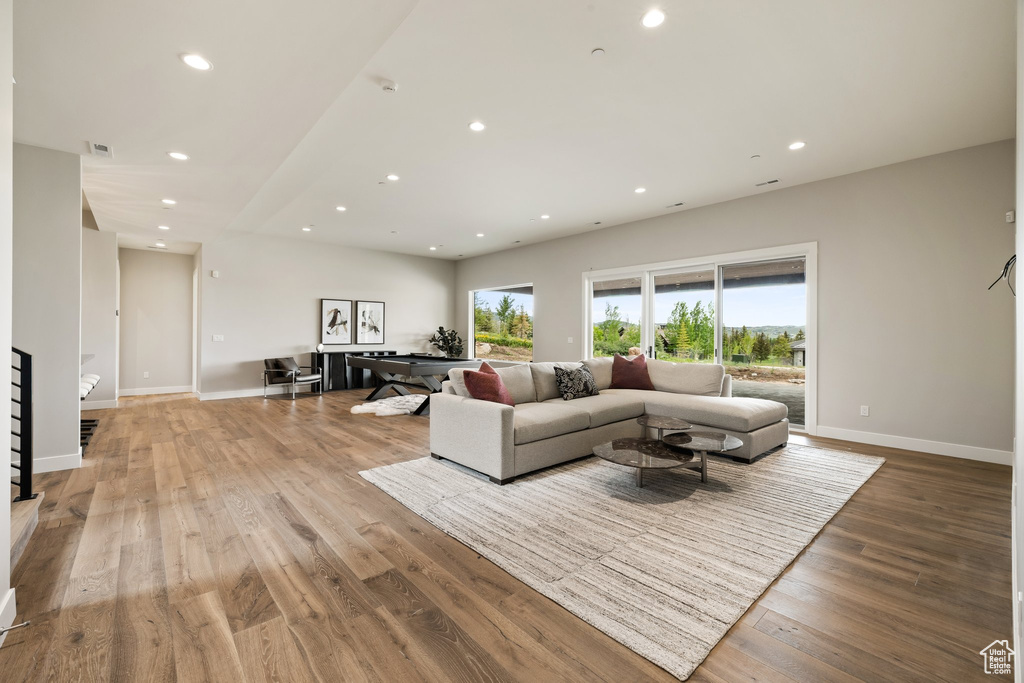 Living area featuring recessed lighting, light wood-type flooring, and baseboards