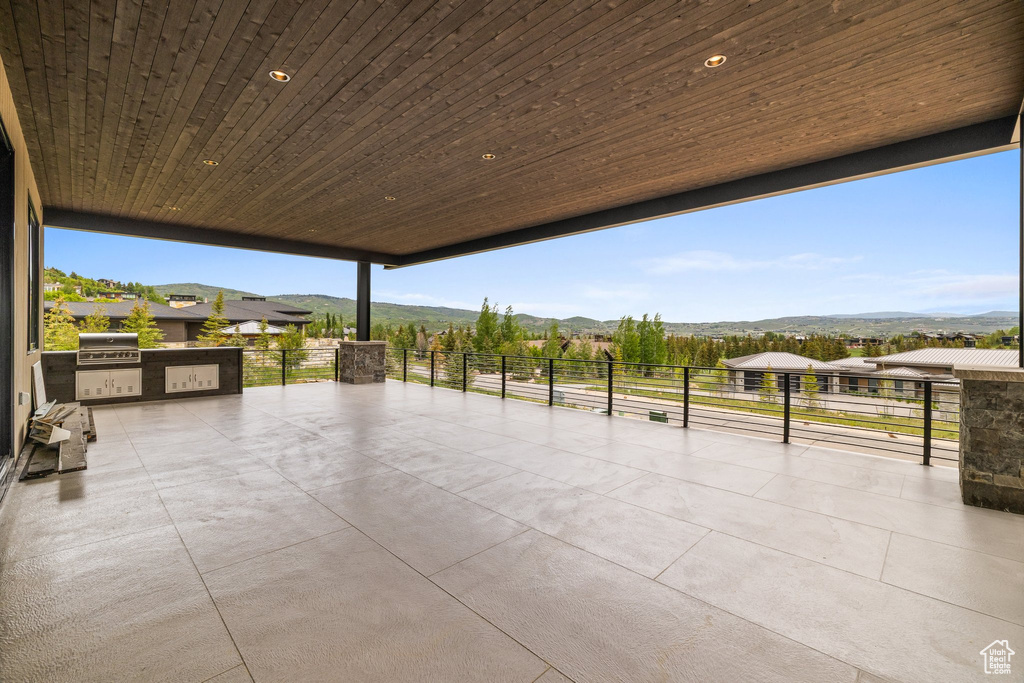 View of patio / terrace with a mountain view and area for grilling