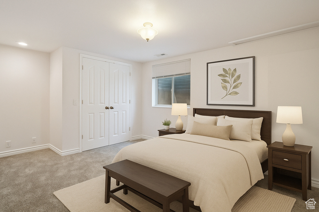 Bedroom featuring carpet flooring and a closet