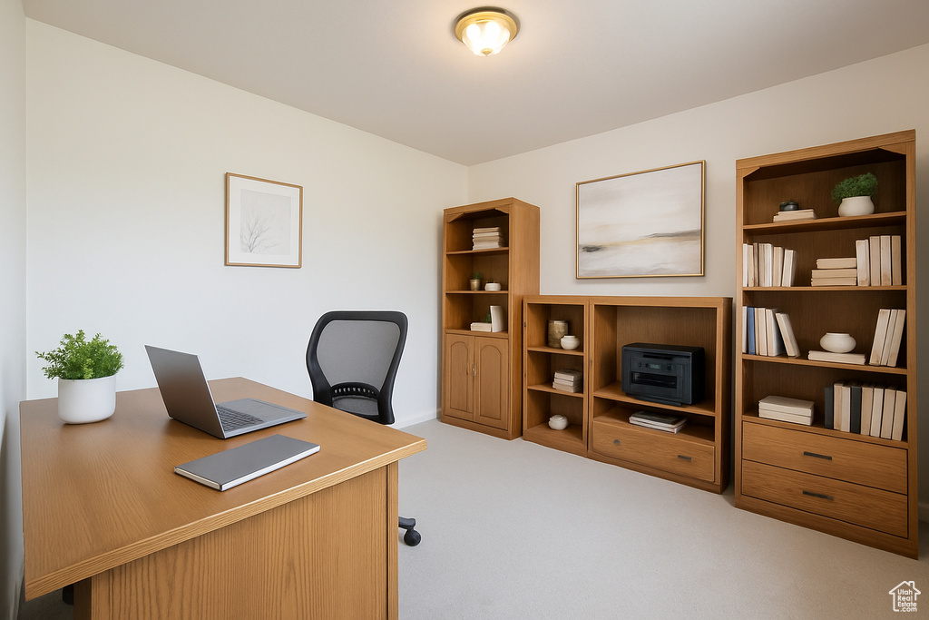 Office space with carpet and baseboards