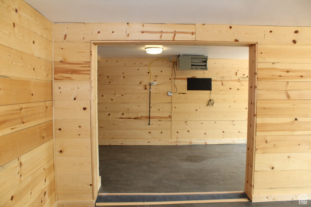 Relaxing sauna / steam room with wooden walls and finished concrete floors