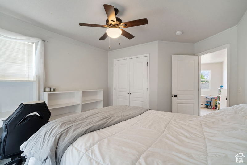 Bedroom featuring a closet and ceiling fan