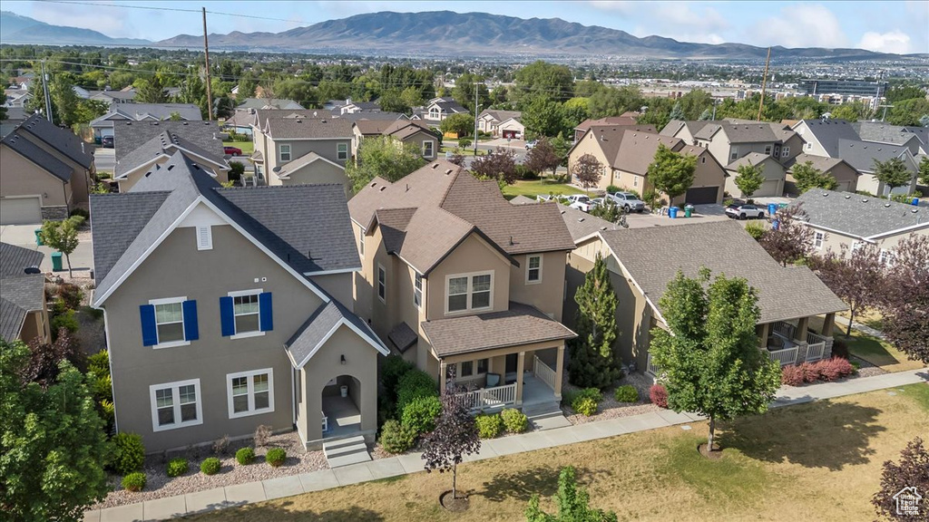 Aerial view of residential area featuring a mountain backdrop