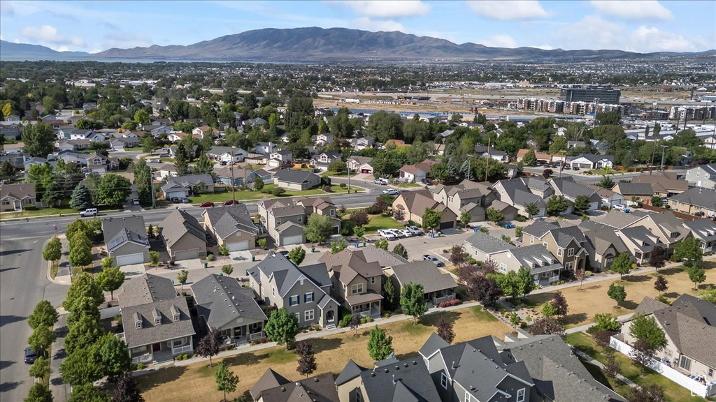 View of property location featuring mountains and nearby suburban area