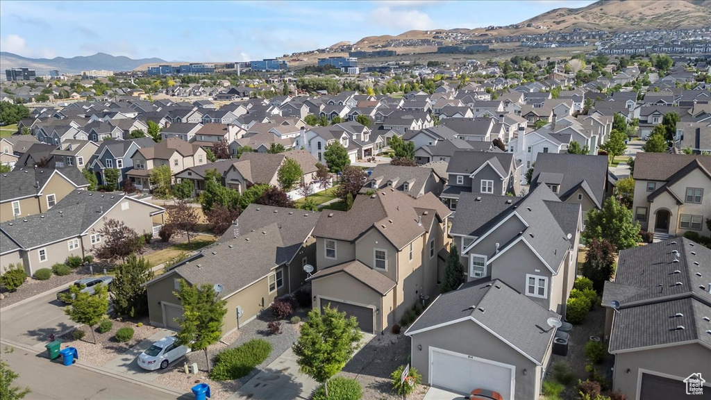 Aerial perspective of suburban area featuring a mountain backdrop