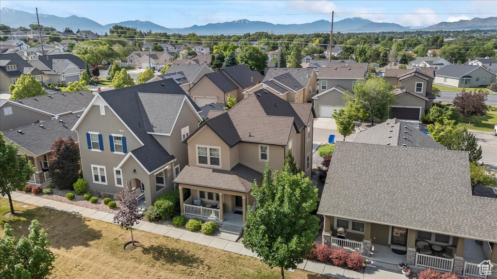 Aerial view of residential area featuring a mountain backdrop