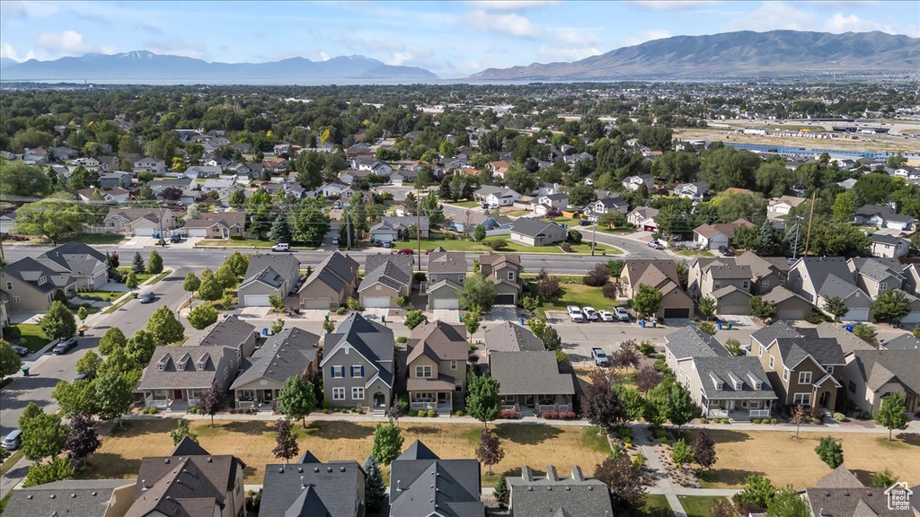 Aerial perspective of suburban area with a mountain backdrop