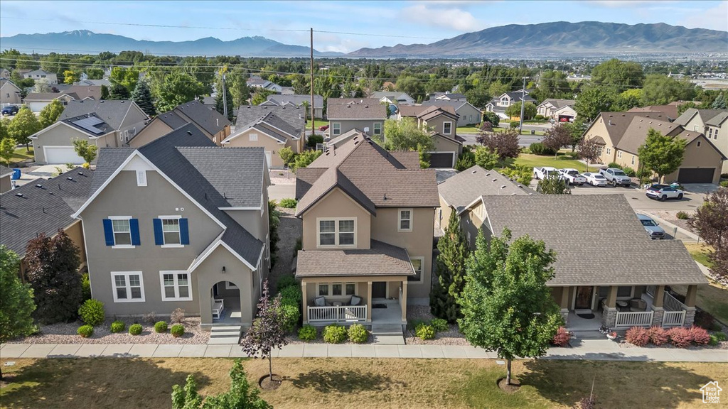 Aerial view of residential area featuring a mountain backdrop