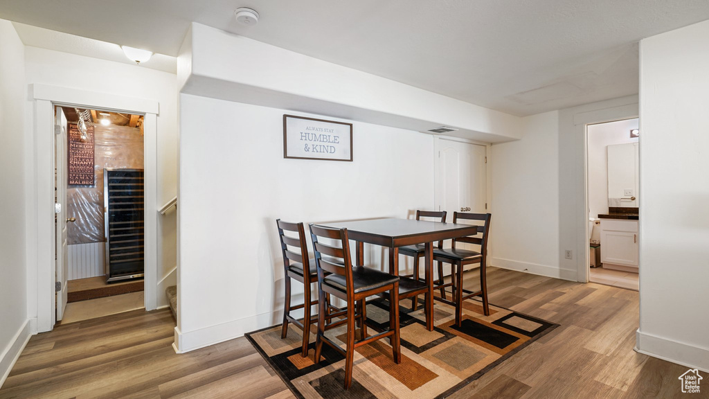 Dining area featuring wood finished floors and baseboards