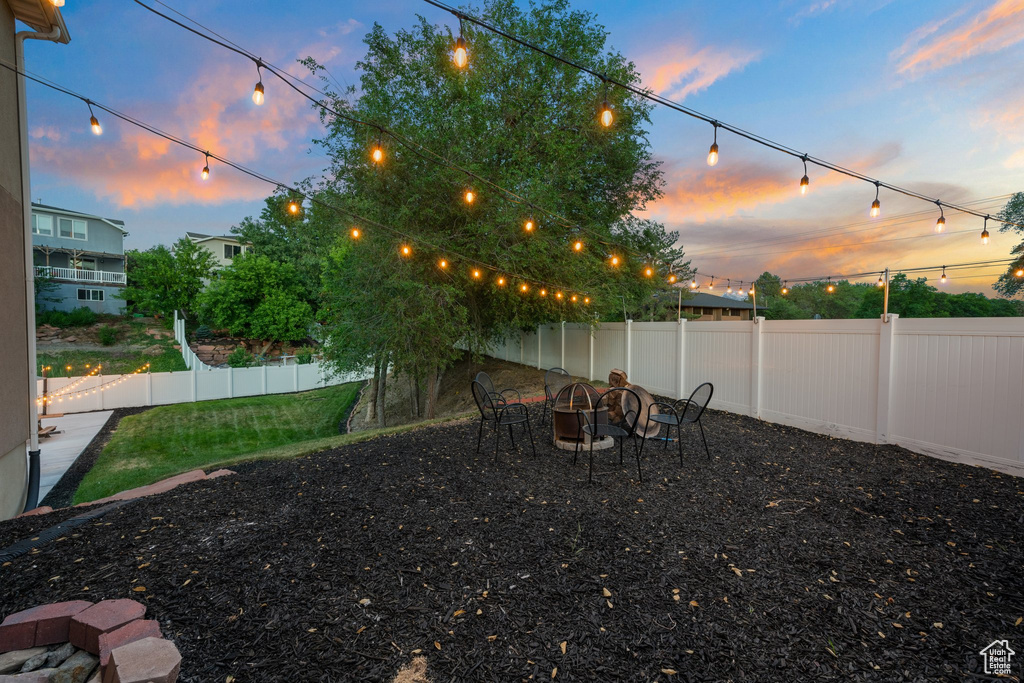Fenced yard with an outdoor fire pit