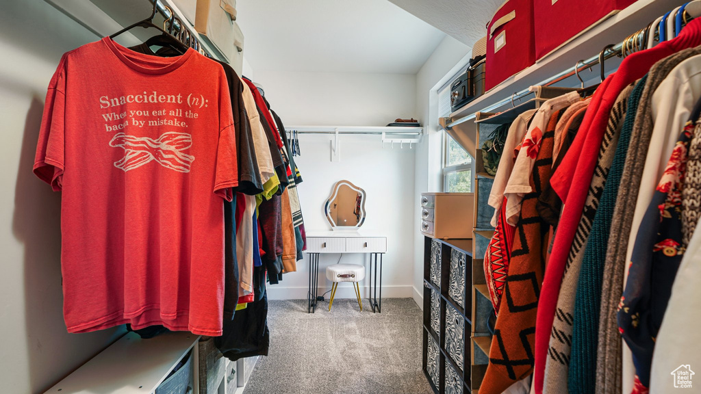 Spacious closet featuring carpet flooring