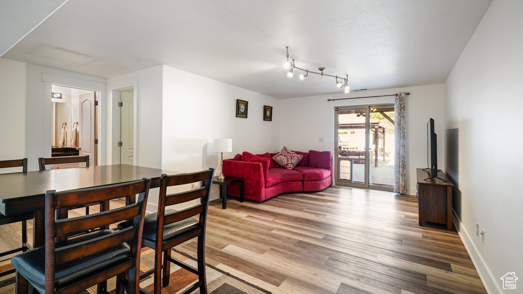 Dining space featuring light wood-style floors and baseboards
