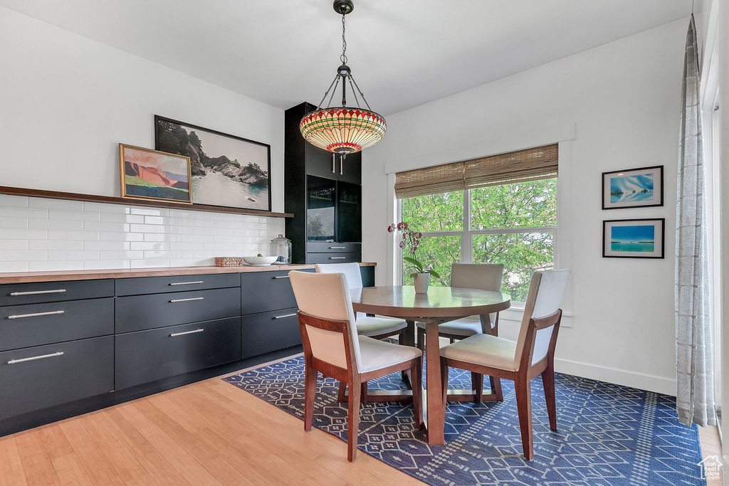 Dining area featuring light wood finished floors and baseboards