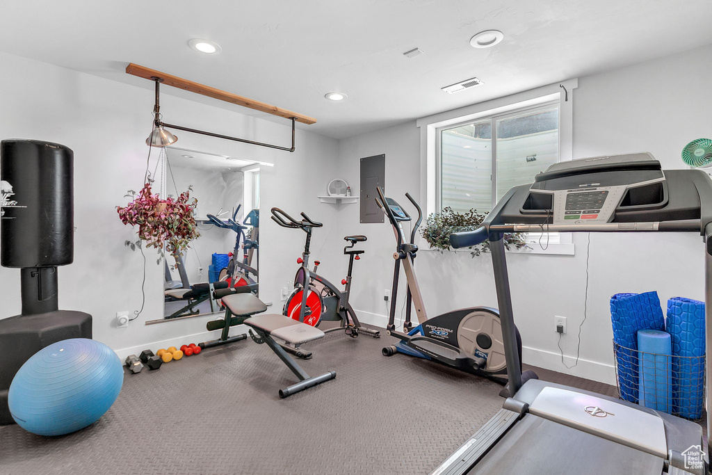 Exercise area featuring recessed lighting and baseboards