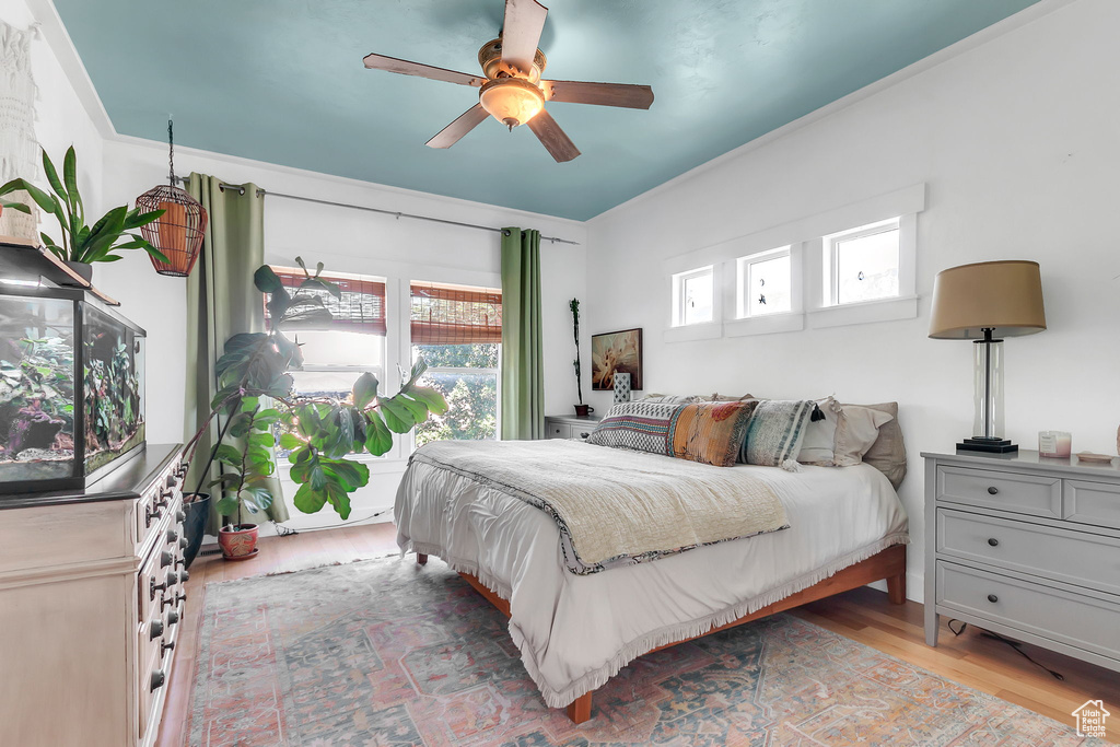 Bedroom with light wood-style flooring and ceiling fan