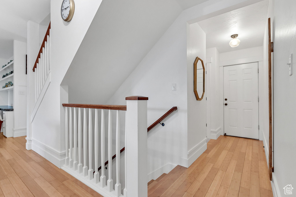 Foyer featuring light wood-type flooring and baseboards